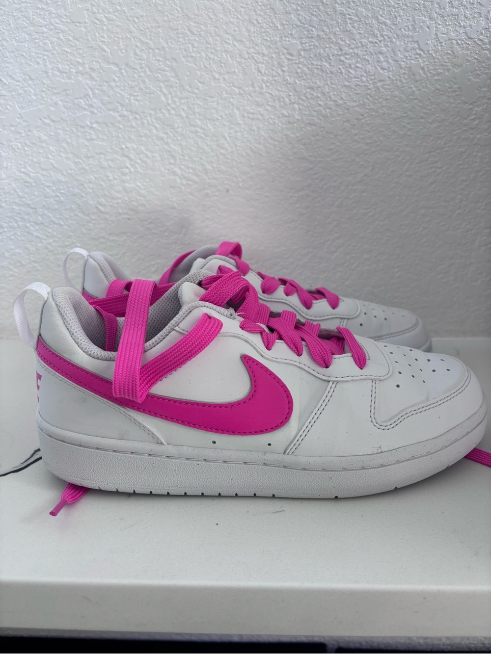 Pink and white Nikes